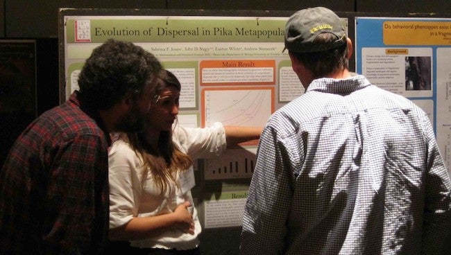 Sabrina Jones explains the finer points of her poster.